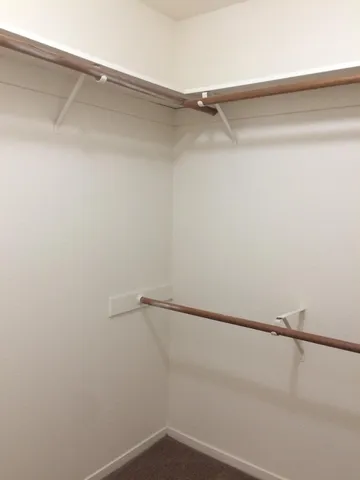 an aerial view of a house with a yard and lake view