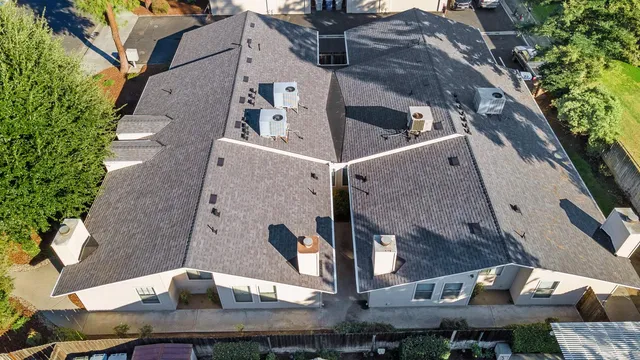 an aerial view of residential building and lake