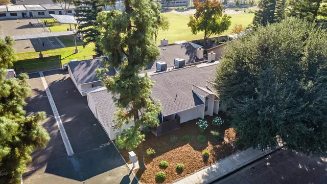 a utility room with cabinets washer and dryer