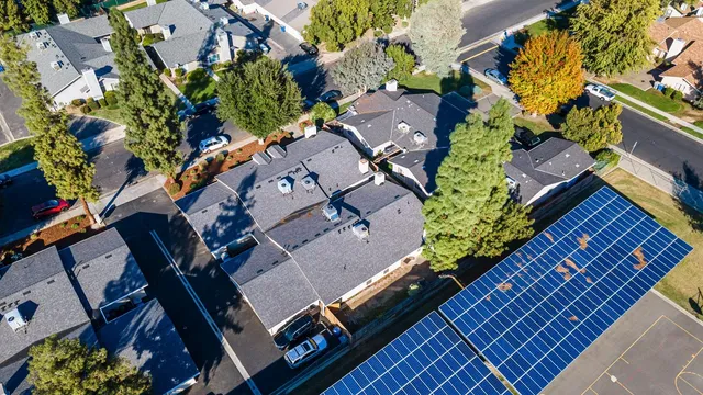 a white toilet sitting next to a bath tub