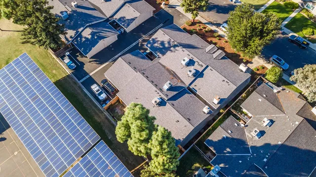 an empty room with wooden floor and mirror