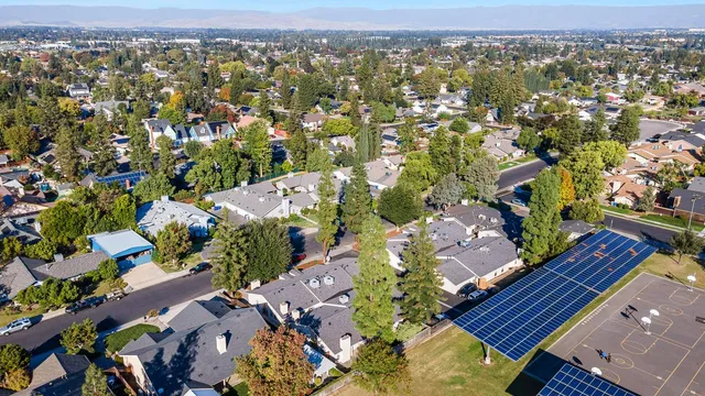 a white toilet sitting next to a shower