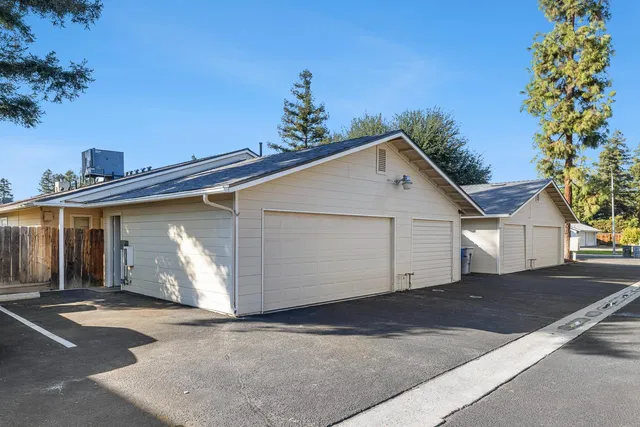 a view of a house with a yard and garage
