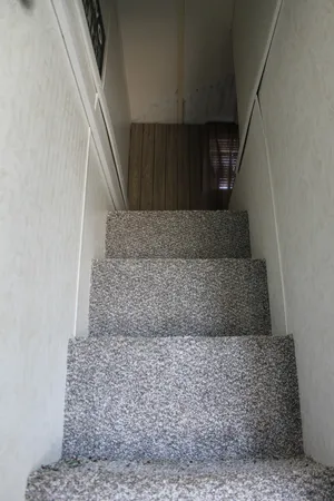 a bedroom with a bed and a fireplace