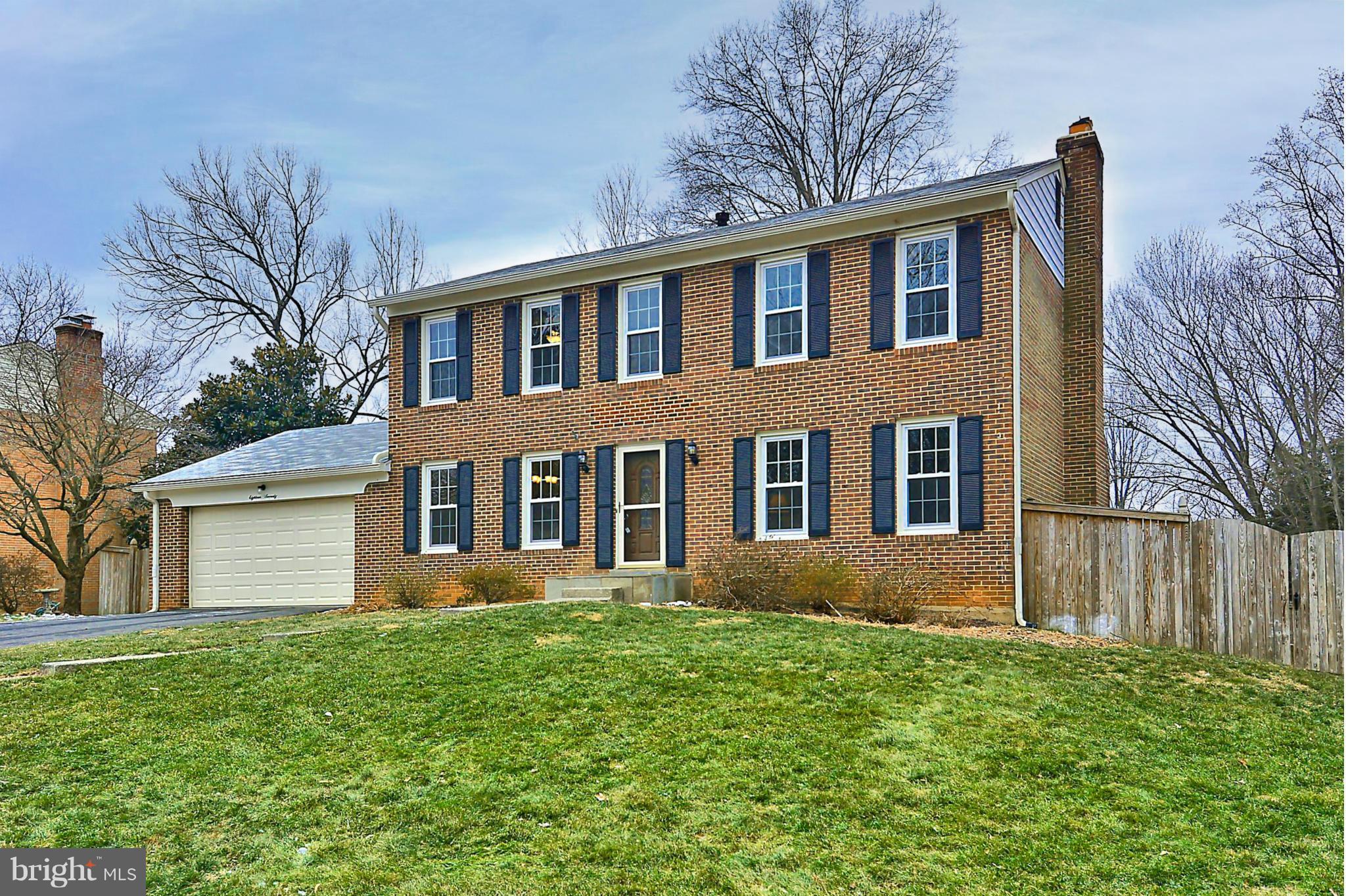 a brick house with a large windows