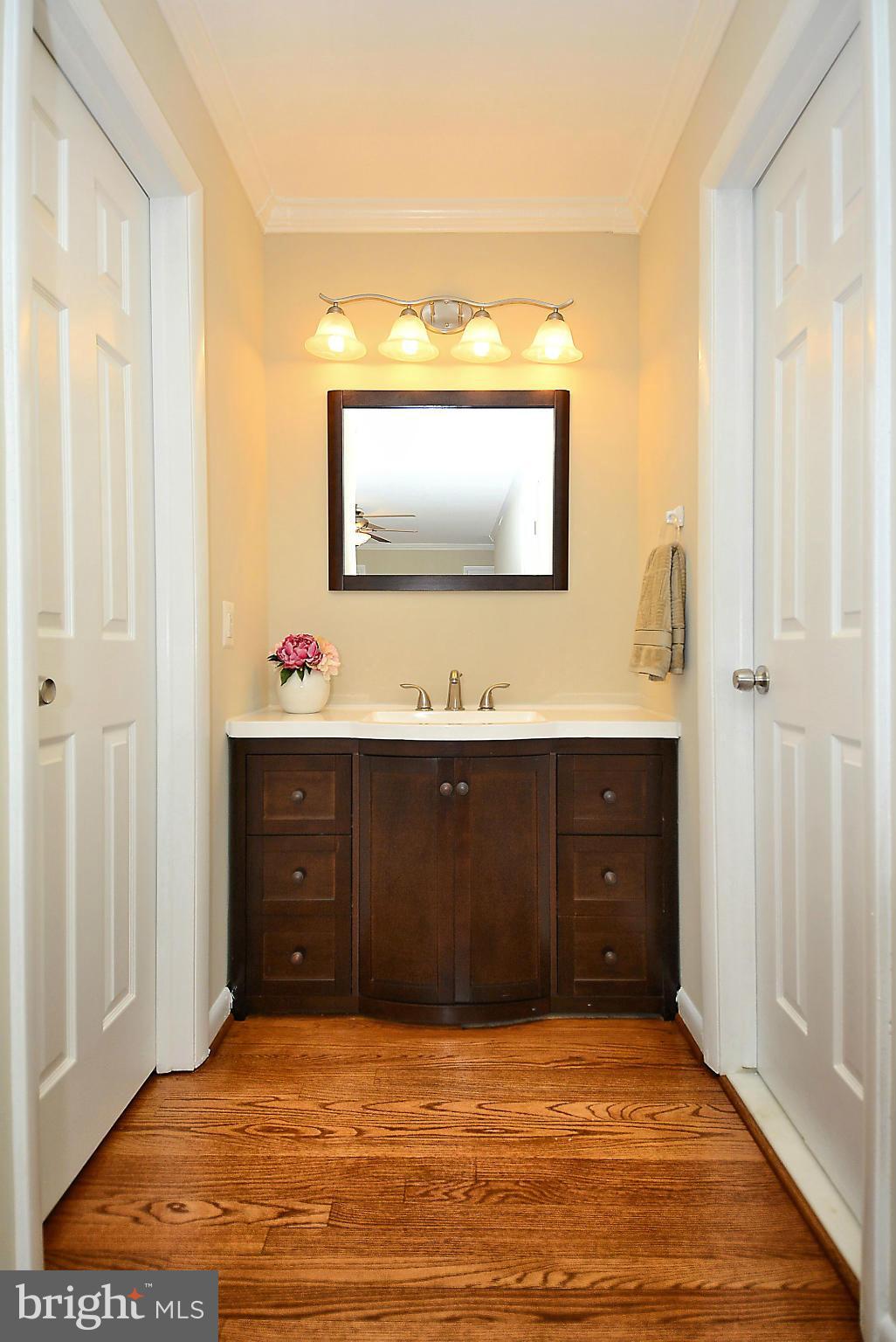 1870 Beulah Road Vienna, VA 22182 - Photo 11 of 30 a bathroom with a sink vanity and mirror
