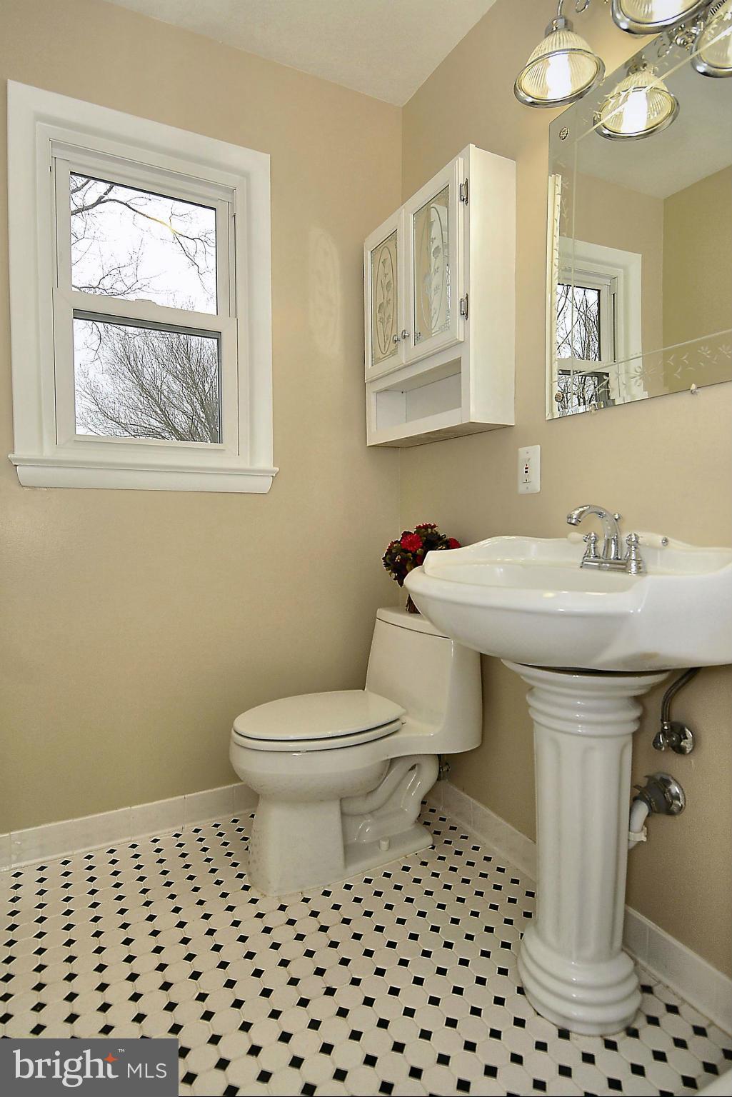 1870 Beulah Road Vienna, VA 22182 - Photo 12 of 30 a bathroom with a sink toilet and mirror