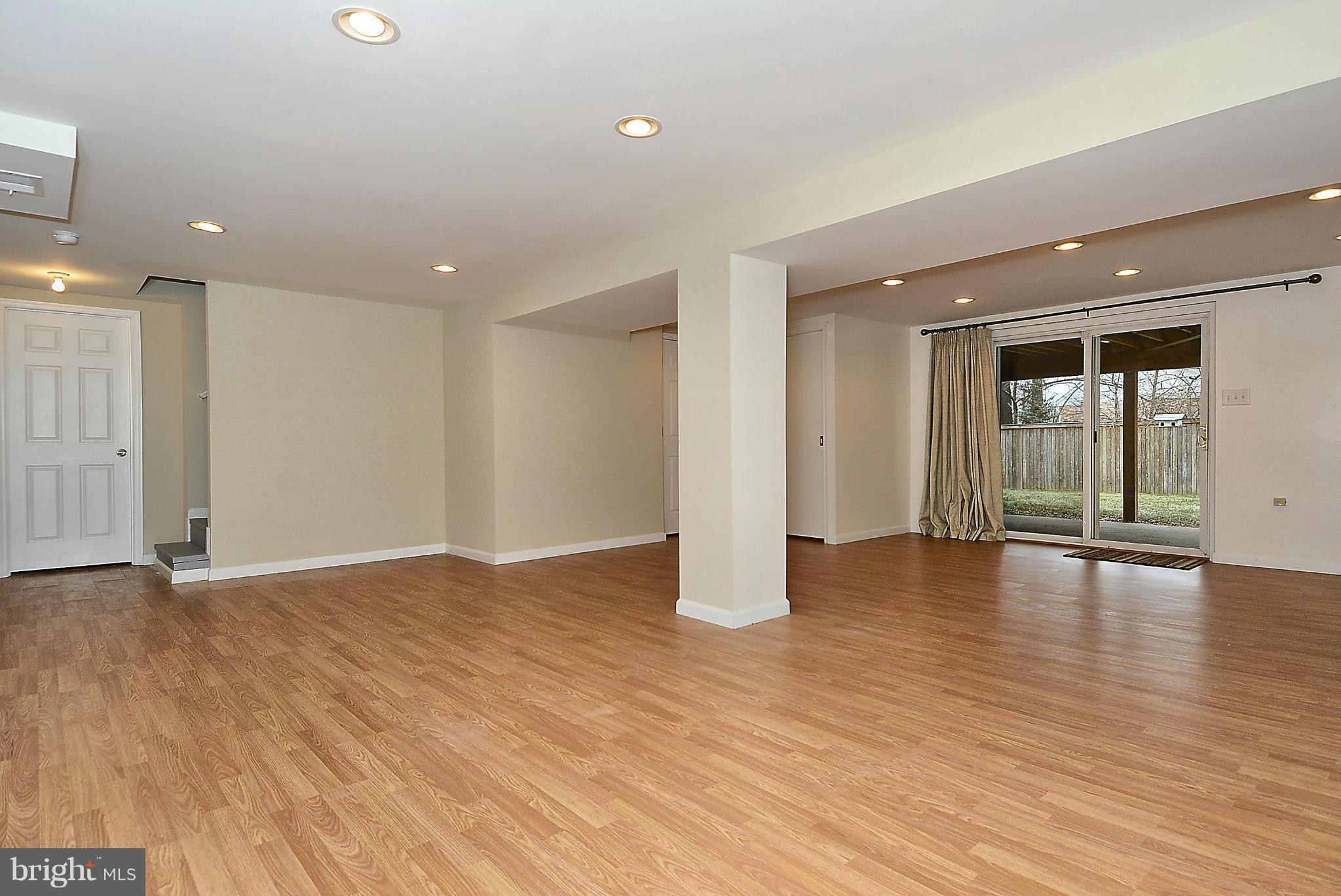1870 Beulah Road Vienna, VA 22182 - Photo 19 of 30 a view of an empty room with wooden floor and a window
