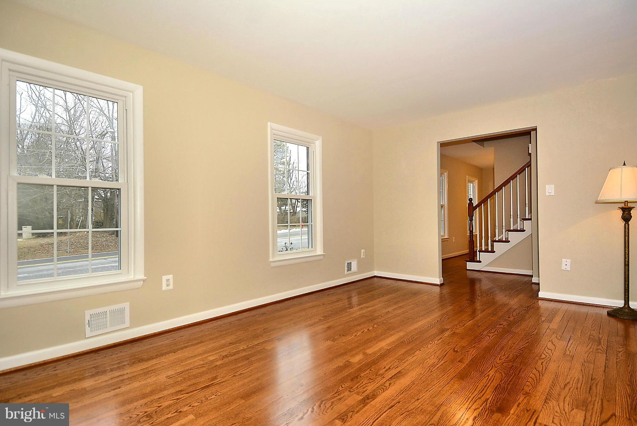 1870 Beulah Road Vienna, VA 22182 - Photo 3 of 30 a view of an empty room with wooden floor and a window