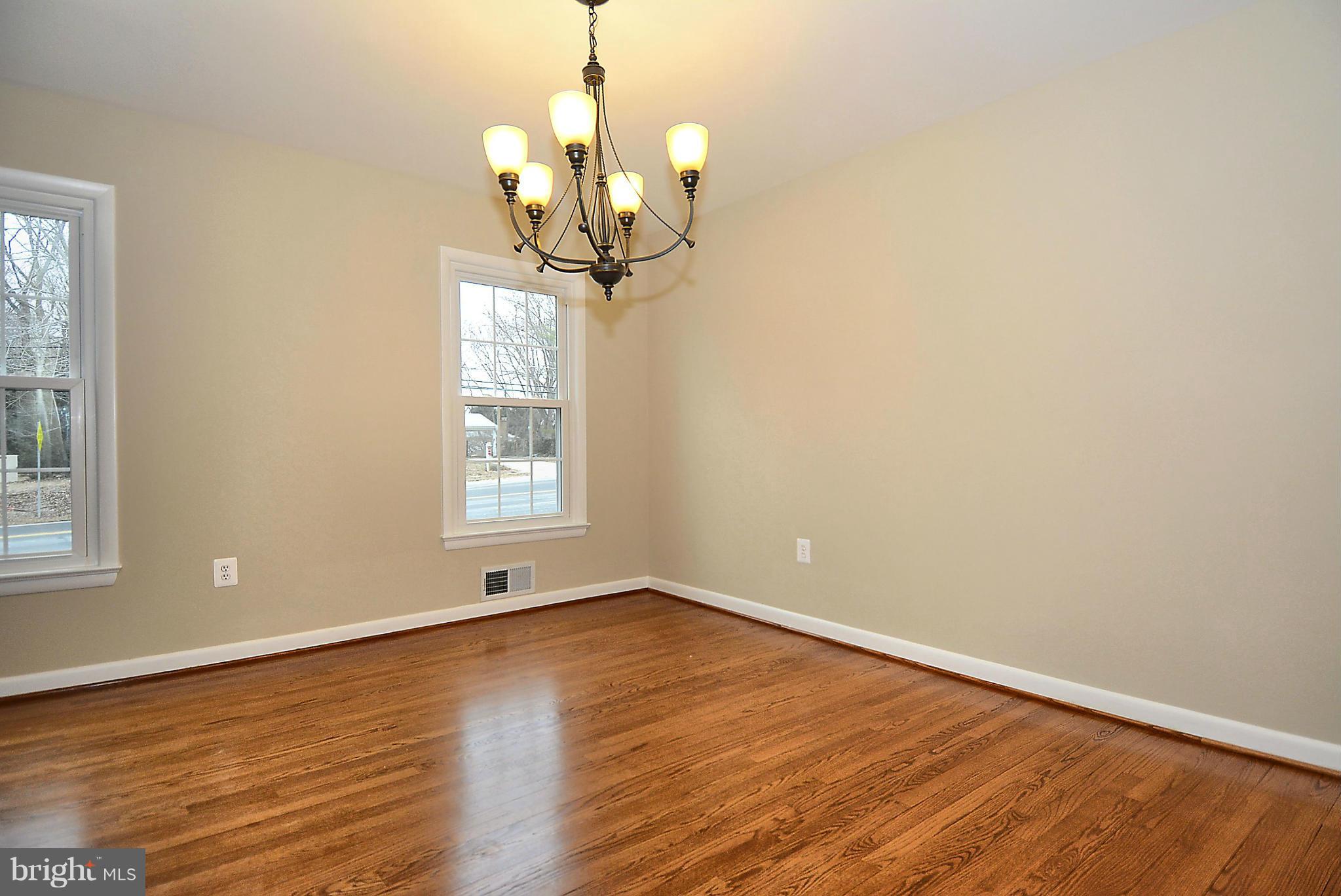 1870 Beulah Road Vienna, VA 22182 - Photo 4 of 30 a view of a room with wooden floor chandelier and windows