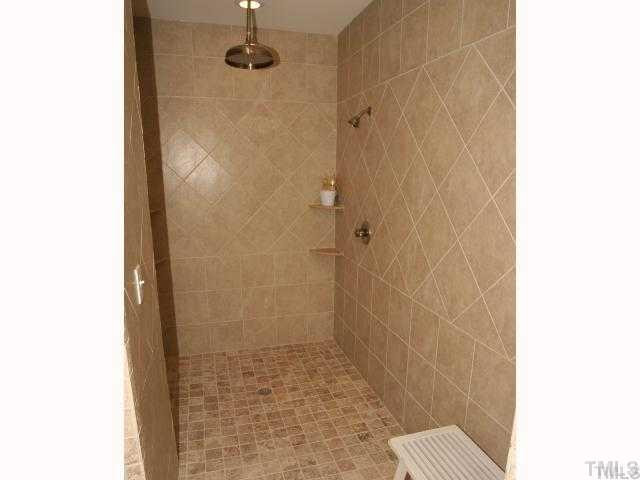 7828 Harps Mill Road Raleigh, NC 27615 - Photo 16 of 25 full walk in/roll in shower! triple shower including rain head! Master Bath/Spa