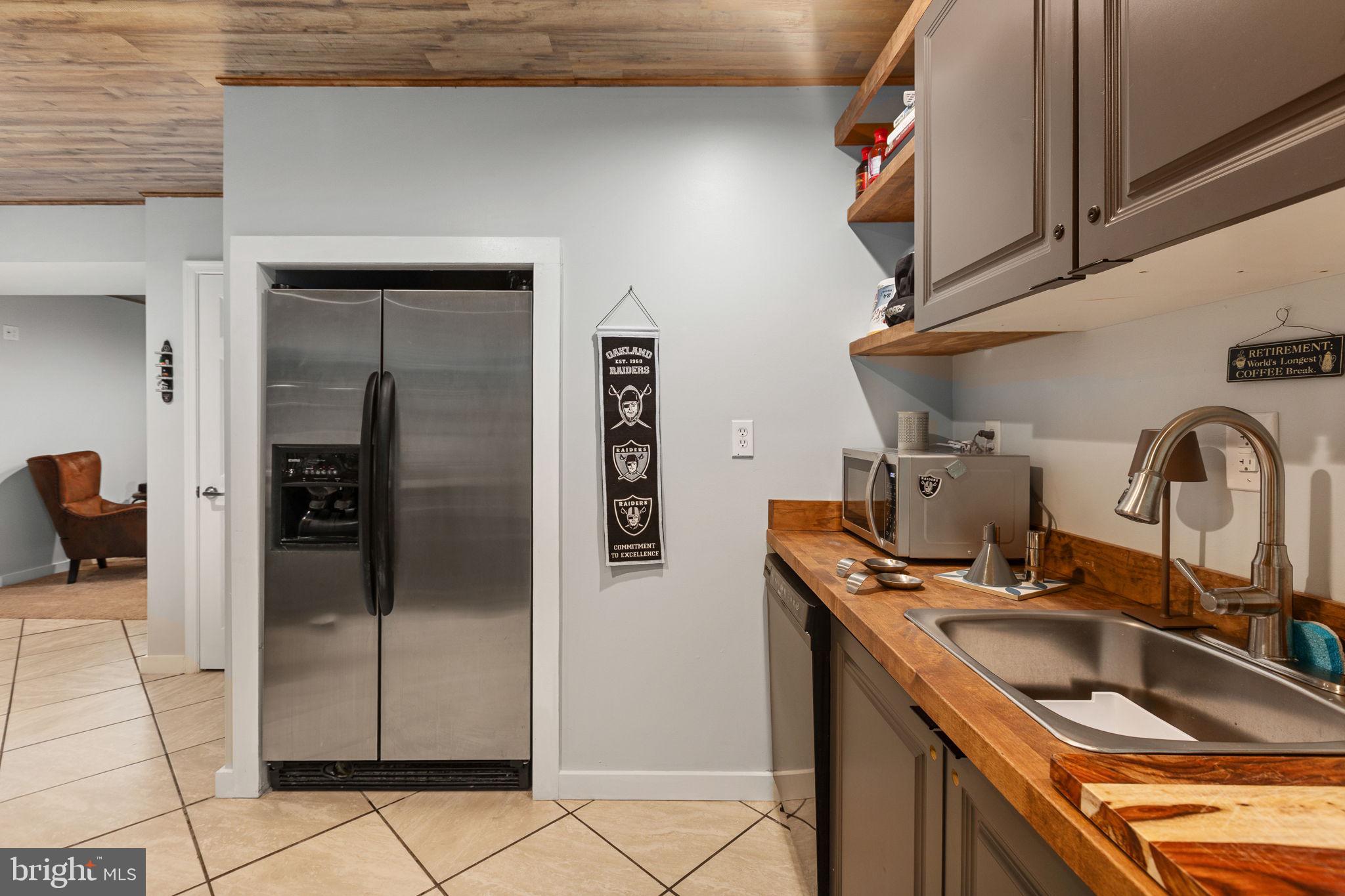 22088 Landora Bridge Road Ruther Glen, VA 22546 - Photo 85 of 122 Modern kitchen with rustic charm.