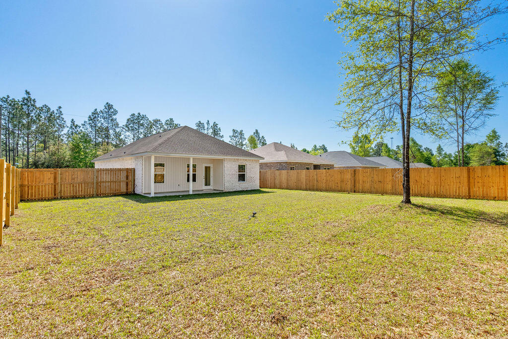 3812 Golden Acres Circle Crestview, FL 32539 - Photo 10 of 10 a house view with swimming pool in front of it