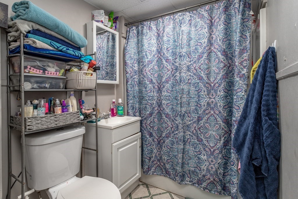 101-105 Baker Street Gardner, MA 01440 - Photo 11 of 37 a bathroom with a toilet and a sink