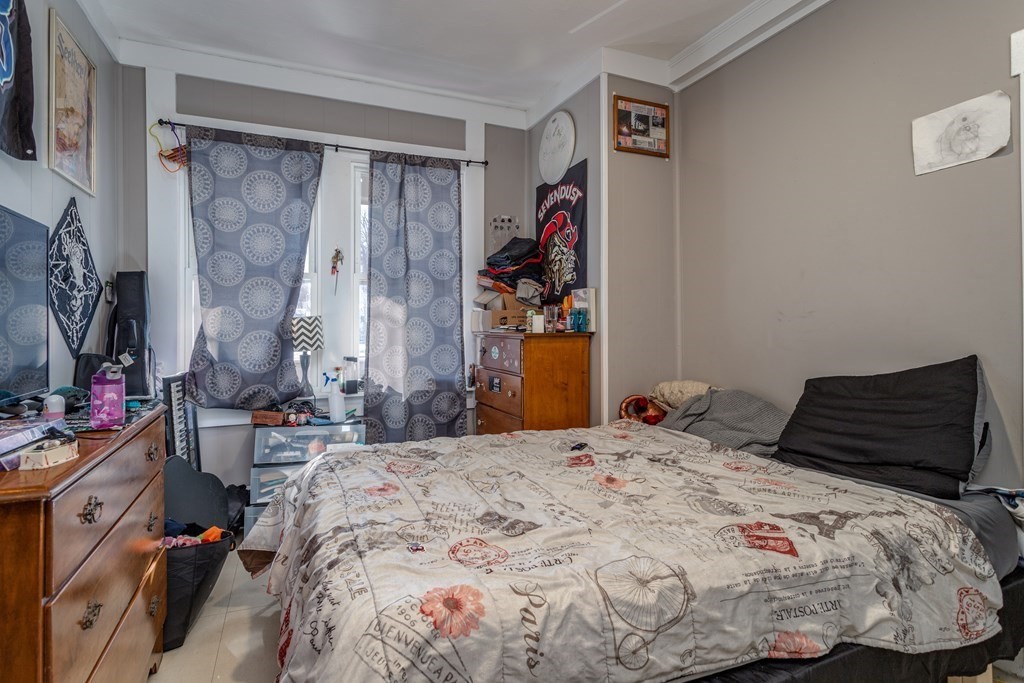 101-105 Baker Street Gardner, MA 01440 - Photo 12 of 37 a bedroom with a bed and a window