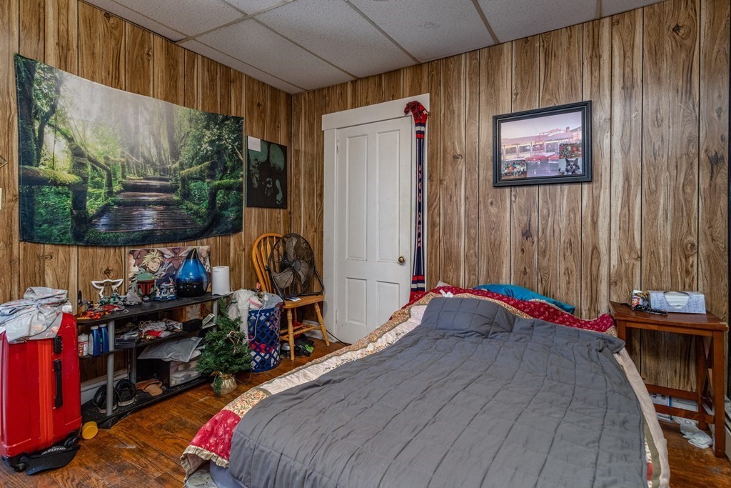 101-105 Baker Street Gardner, MA 01440 - Photo 14 of 37 a bed room with a bed and a store