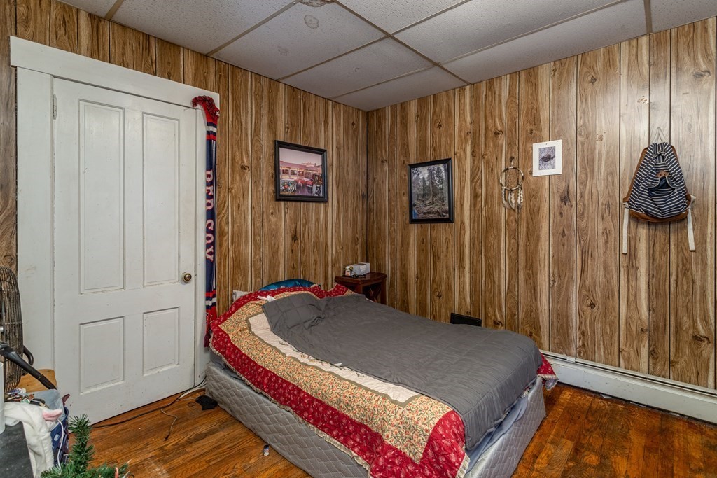 101-105 Baker Street Gardner, MA 01440 - Photo 15 of 37 a bedroom with a bed and a cabinet