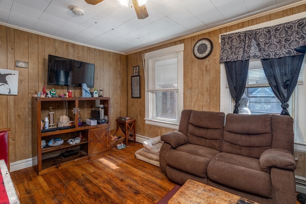 101-105 Baker Street Gardner, MA 01440 - Photo 16 of 37 a living room with furniture and a window