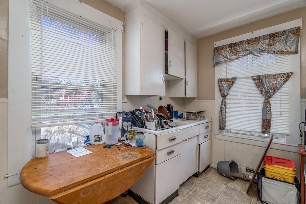 101-105 Baker Street Gardner, MA 01440 - Photo 19 of 37 a room with furniture and a window