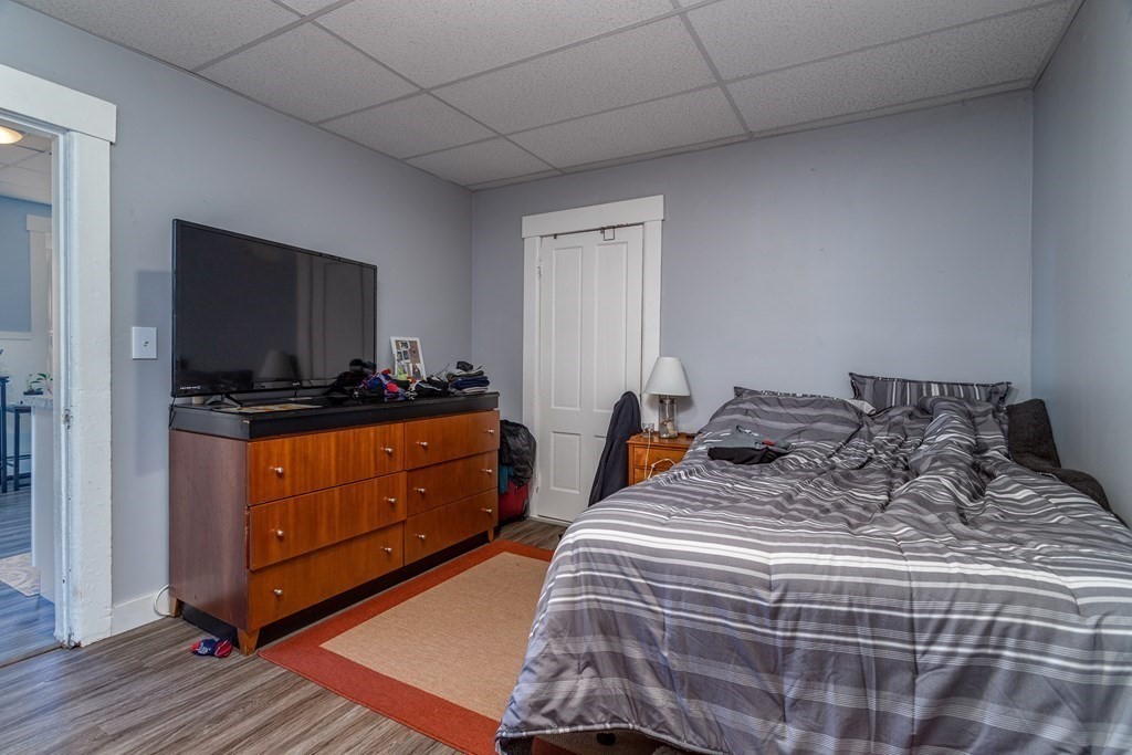 101-105 Baker Street Gardner, MA 01440 - Photo 22 of 37 a bedroom with a bed and flat screen tv