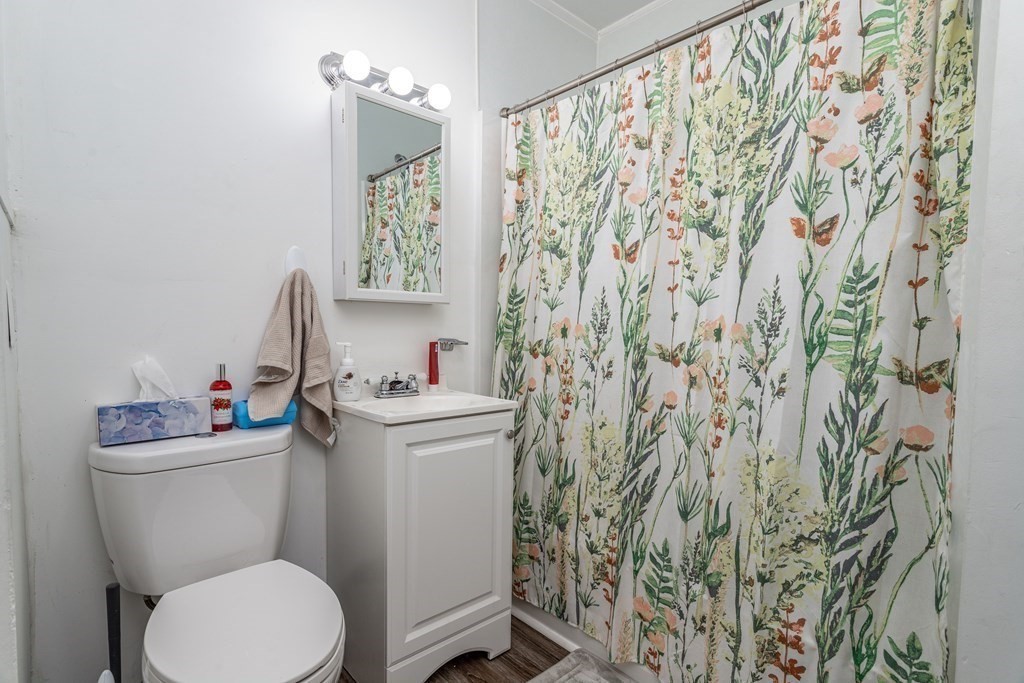 101-105 Baker Street Gardner, MA 01440 - Photo 24 of 37 a bathroom with a toilet and a sink