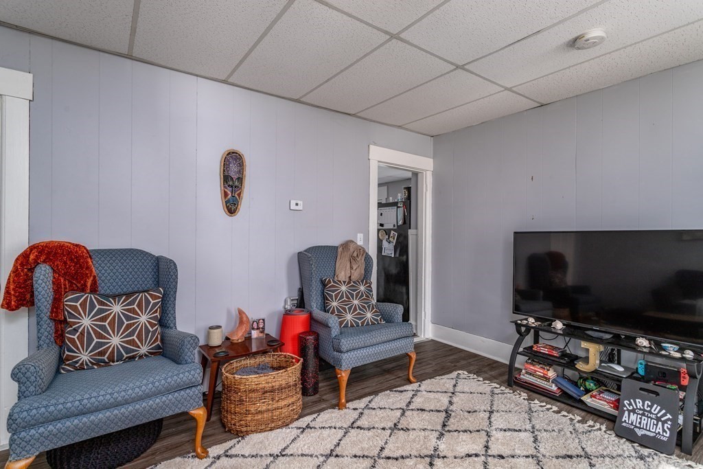 101-105 Baker Street Gardner, MA 01440 - Photo 30 of 37 a living room with furniture and a flat screen tv