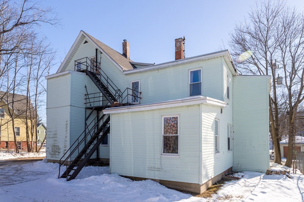 101-105 Baker Street Gardner, MA 01440 - Photo 3 of 37 a view of a house with a snow