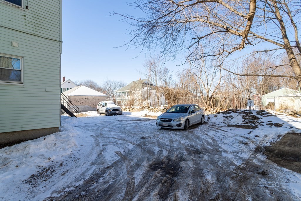 101-105 Baker Street Gardner, MA 01440 - Photo 5 of 37 a view of backyard with a white house