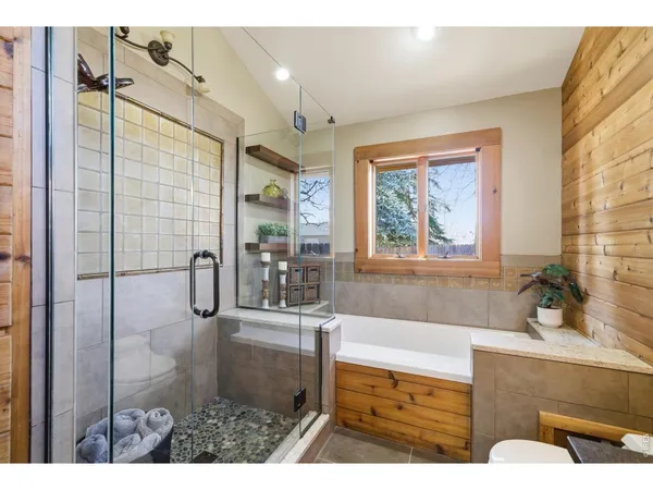 a bathroom with a sink mirror toilet and bathtub