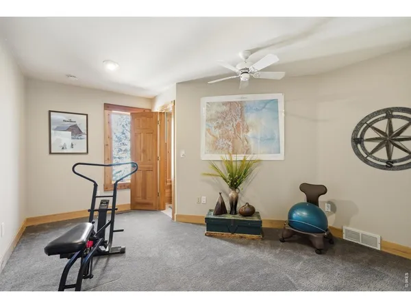 a living room with furniture a window and a chandelier