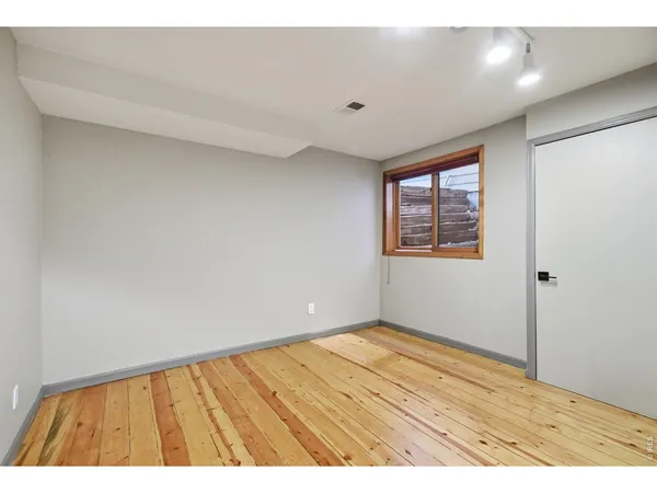 a view of an empty room and window