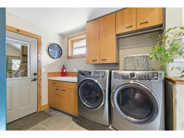 a utility room with closet dryer and washer