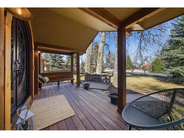 a view of living room and floor to ceiling window with wooden floor