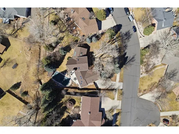an aerial view of a house with a yard