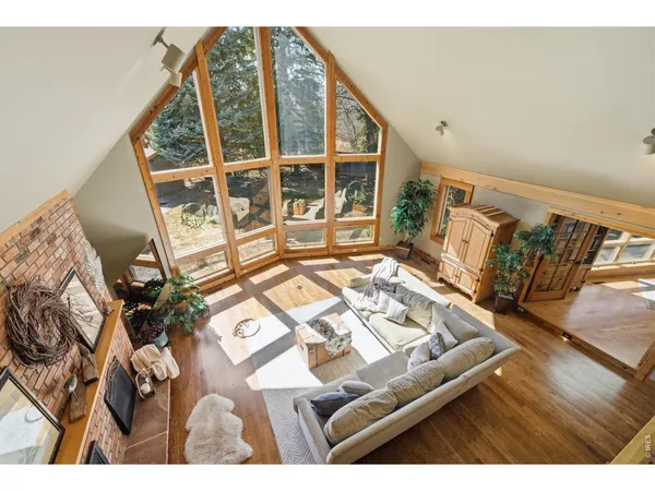 a living room with a rug and a table
