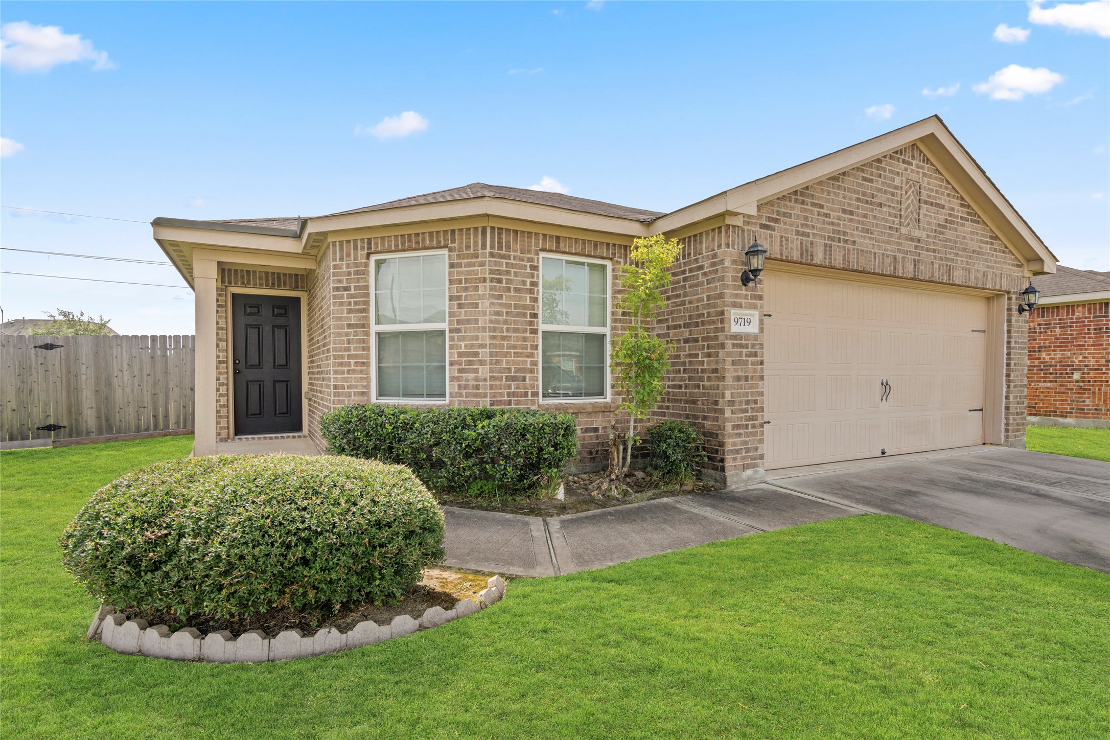 9719 Montana Sapphire Lane Rosharon, TX 77583 - Photo 2 of 40 Front view highlighting the home’s brick facade, landscaping, and spacious lot setting.