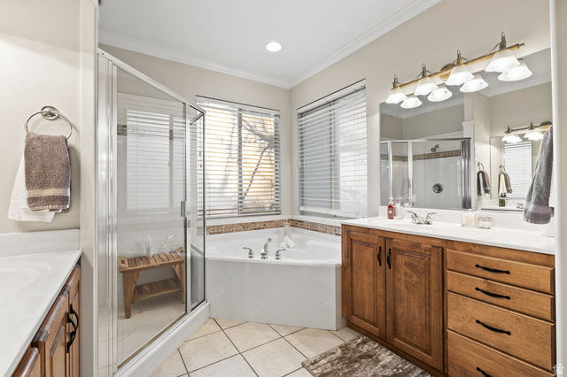 6208 West Bull River Road Highland, UT 84003 - Photo 36 of 90 Bathroom featuring a corner soaking tub, a glass-enclosed shower, a double vanity with wood-finish cabinetry, and tiled flooring