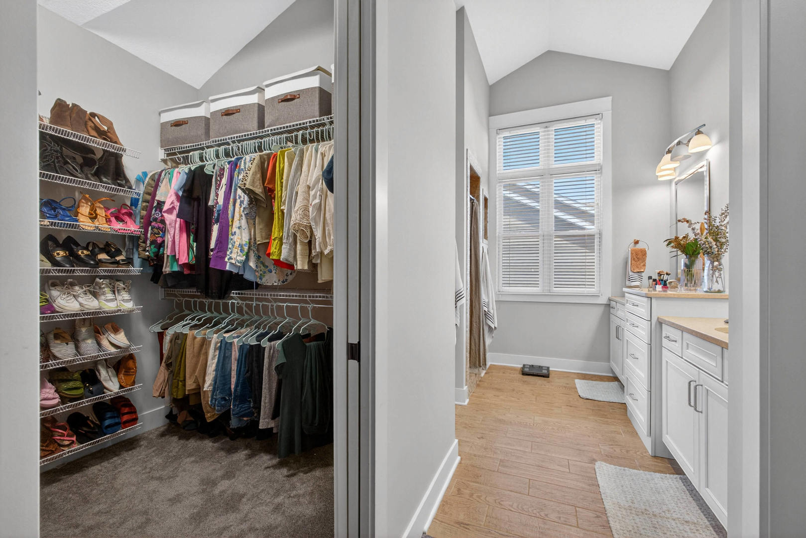 5700 Emily Road Bettendorf, IA 52722 - Photo 34 of 58 a view of walk in closet with clothes and shoes