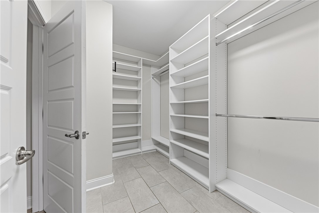 113 Logans Way Kingsland, GA 31548 - Photo 18 of 32 Walk in closet off the primary bath with custom shelving.