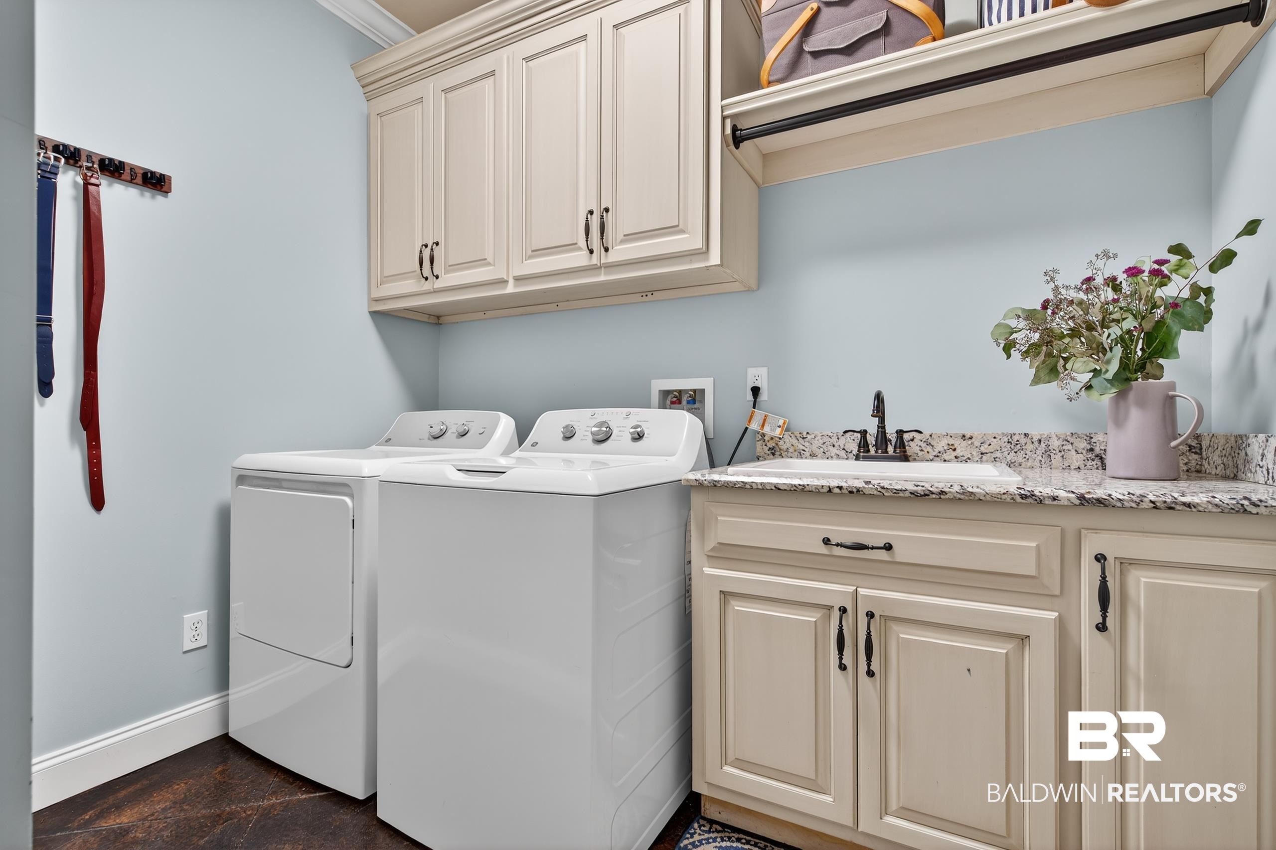 5517 Rabbit Creek Drive Theodore, AL 36582 - Photo 26 of 33 Laundry area with washing machine and clothes dryer and cabinet space