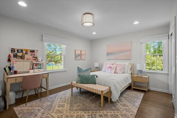 a bedroom with a bed and a desk