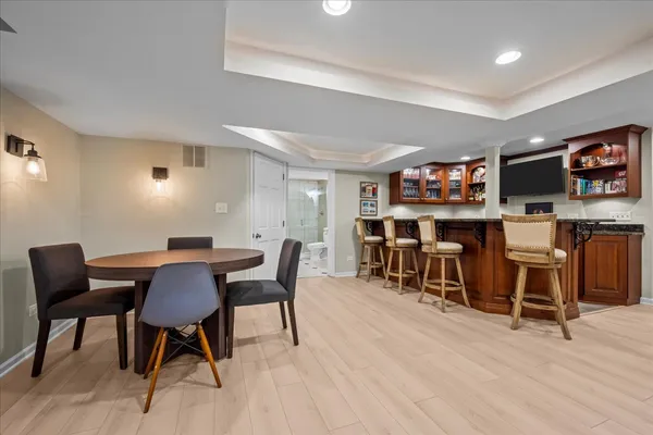 a view of a dining room with furniture and wooden floor