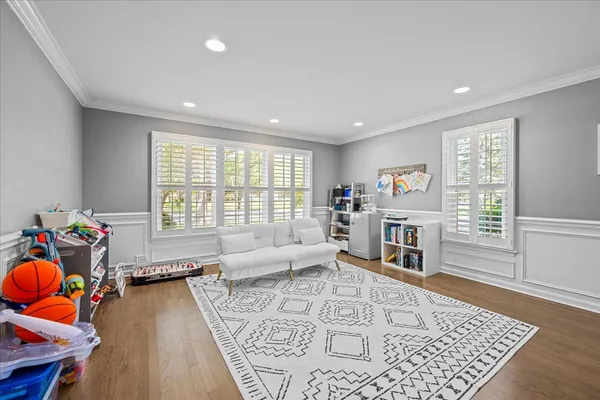 a living room with furniture and a rug