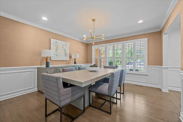 a view of a dining room with furniture window and wooden floor