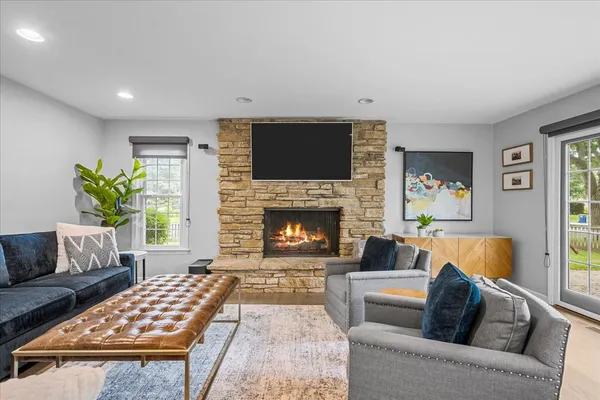 a living room with furniture and a fireplace