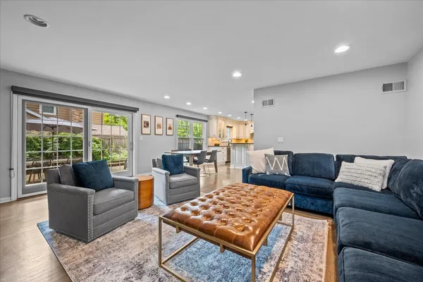 a living room with furniture and a rug