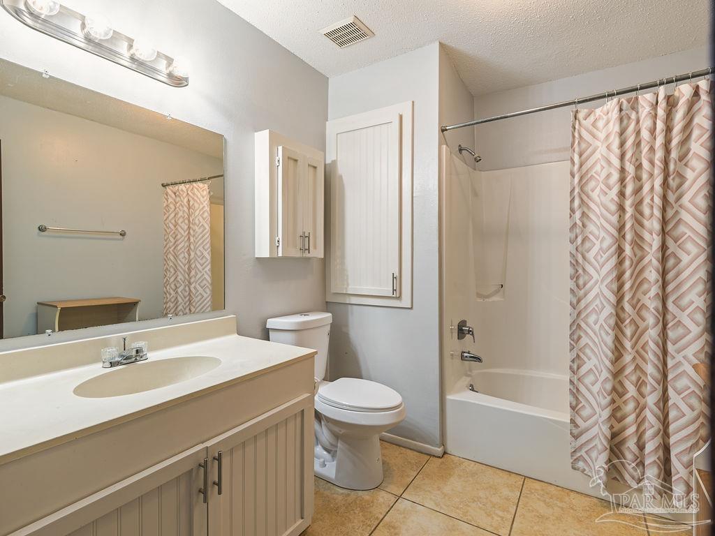 609 Dog Track Road Pensacola, FL 32506 - Photo 22 of 22 a bathroom with a sink toilet and shower