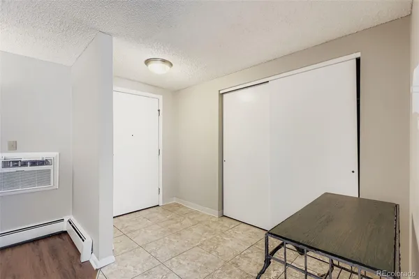 a view of a dining room with a table and chairs