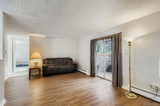 a view of a dining room with a table and chairs