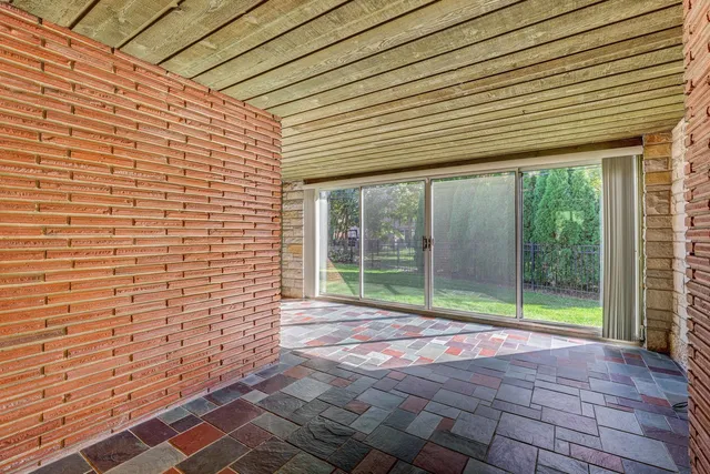 a view of backyard with large windows